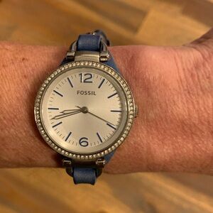 Fossil ladies watch with dark teal leather band.